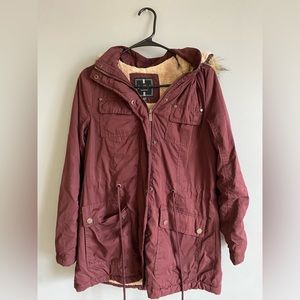Burgundy warm jacket.